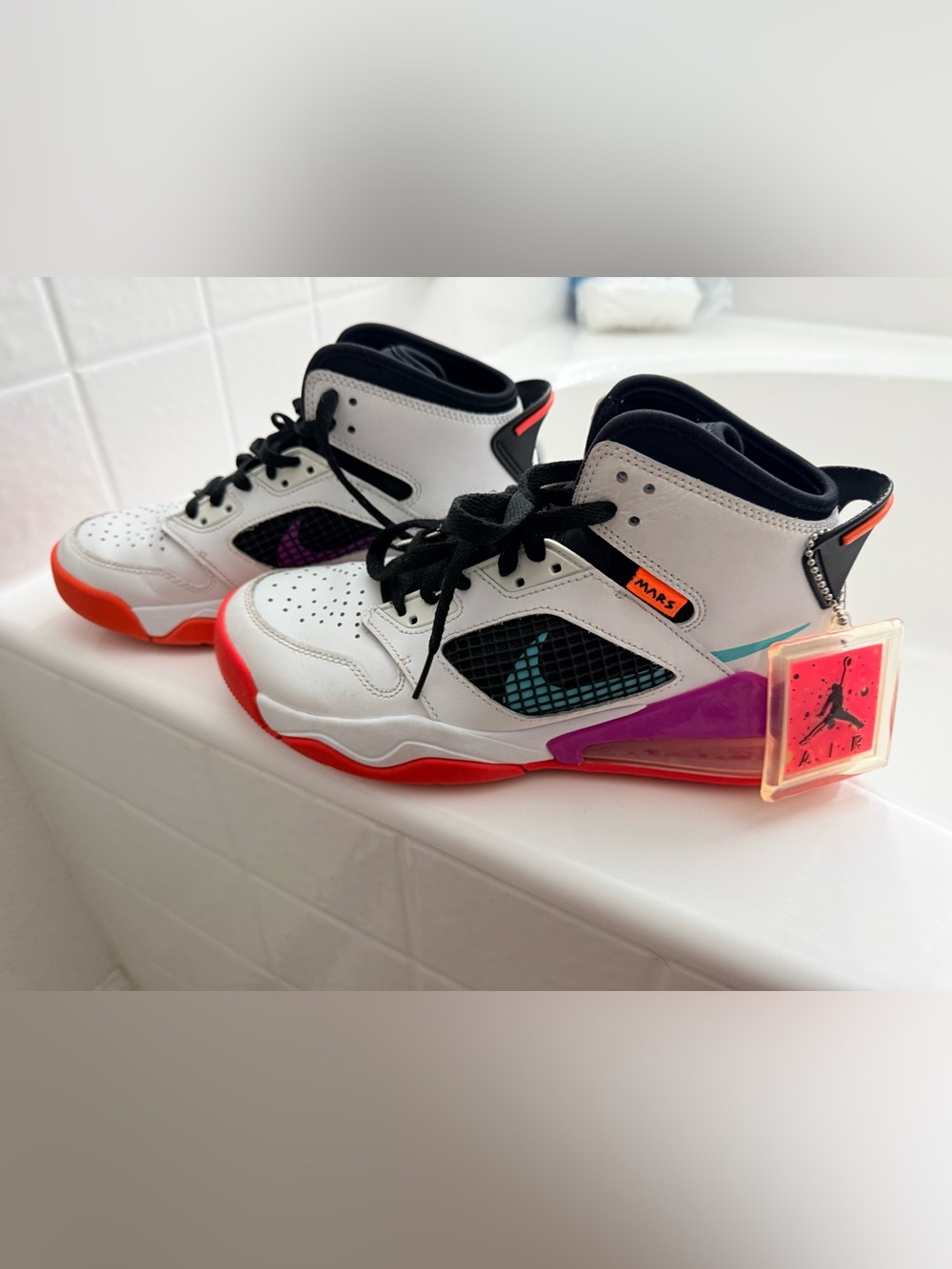 Jordan Kids White Sneaker with Red, Purple & Teal Accents